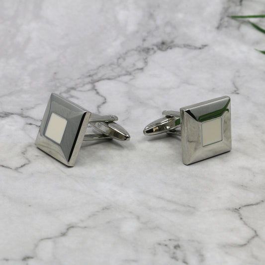 Silver toned metal square cufflinks with white centre